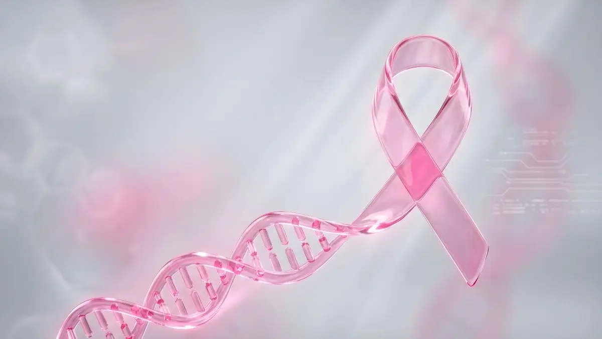 Rosa DNA-Helix neben rosa Awareness-Schleife als Symbol fuer genetische Faktoren bei familiaerem Brust-und-Eierstockkrebs